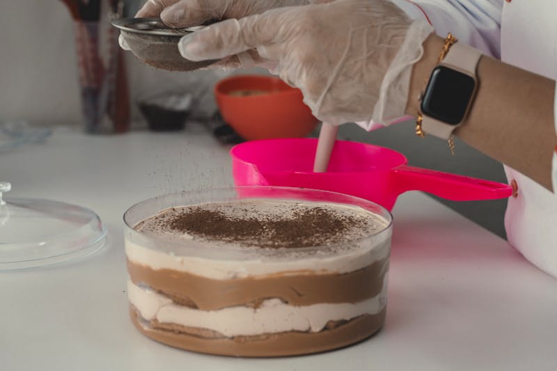 Talented pastry chef at Pizza factory preparing artisan desserts